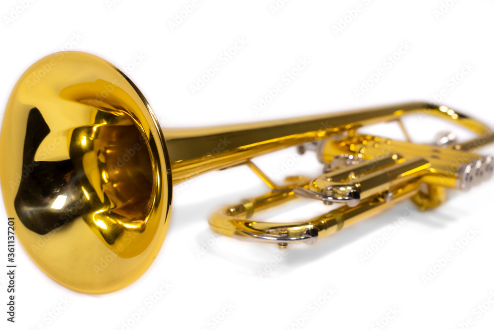 Obraz premium A brass trumpet / only the instrument, isolated white background / front wide pipe is in focus