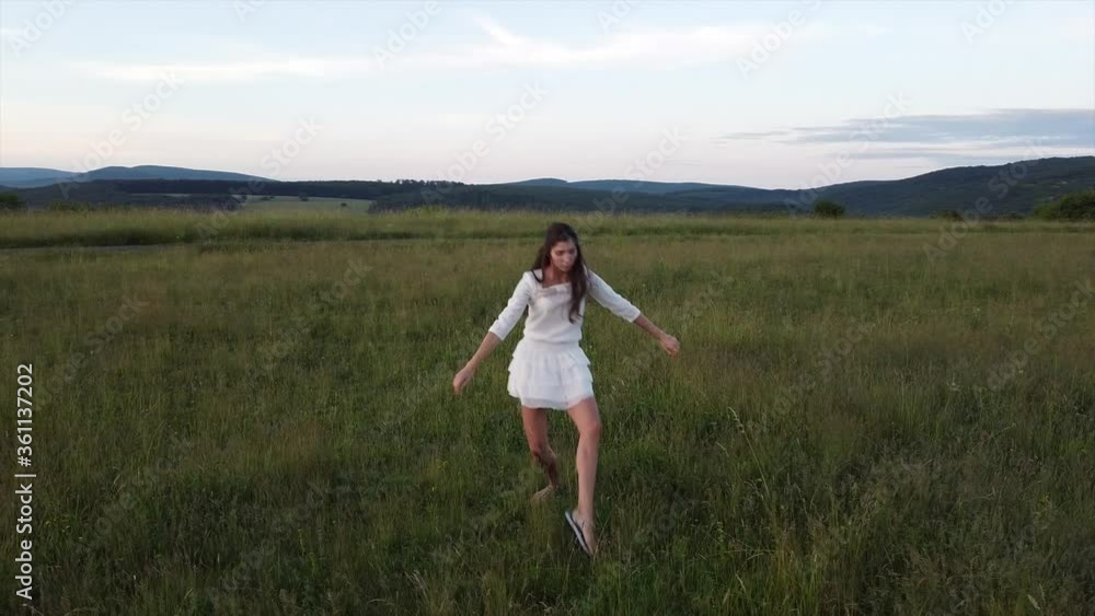 Aerial: Dancer in the green field. Professional ballet dancer camera middle angel. Aerial: Dancer in the green field. Professional ballet dancer camera middle angel.