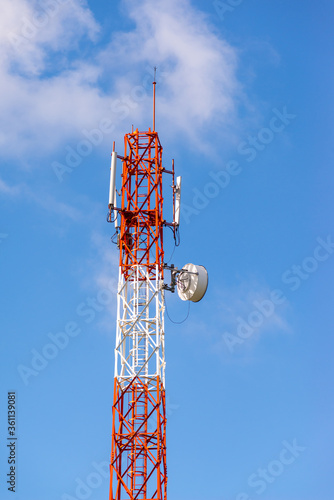 Telecom tower pole with white cloud and blue sky background