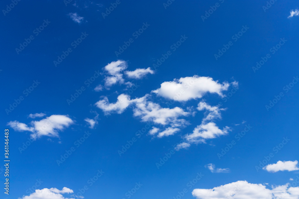 White clouds on a blue sky. Clear weather White clouds on a blue sky. Clear weather