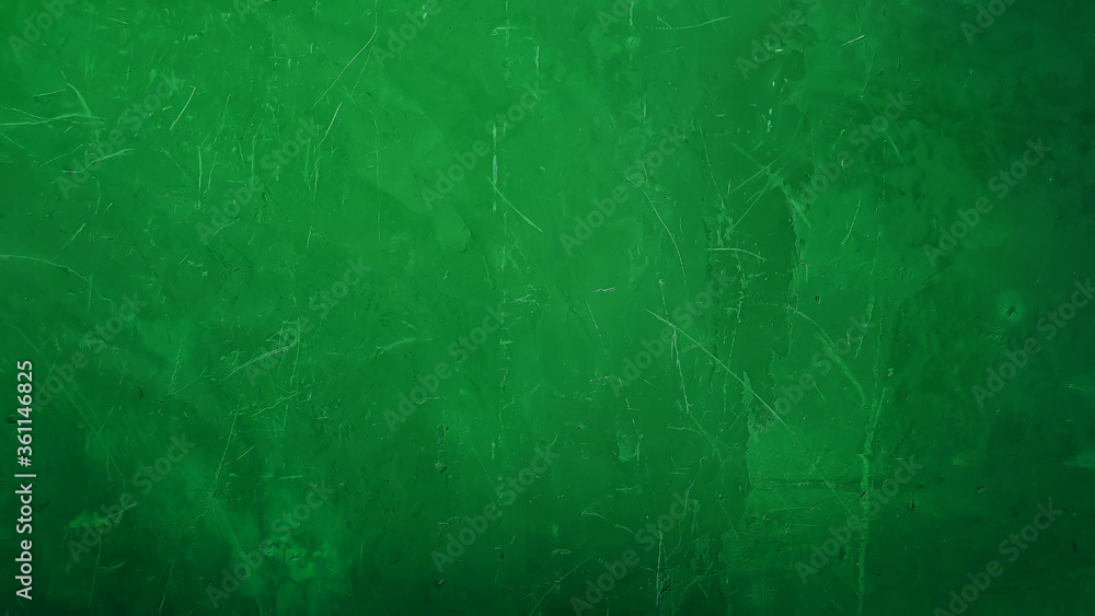 bright green gradient plaster concrete wall background. aged wall with scratched and holes but seem smooth. abstract christmas concept background. bright green gradient plaster concrete wall background. aged wall with scratched and holes but seem smooth. abstract christmas concept background.