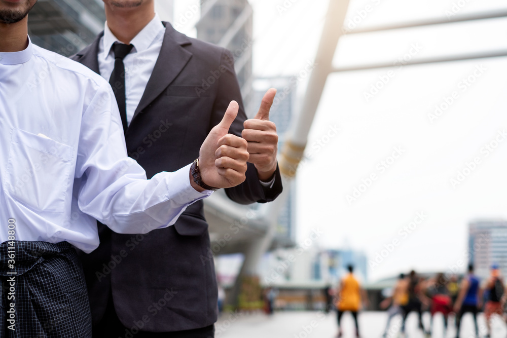 Group of businessman showing thumbs up of successful Group of businessman showing thumbs up of successful