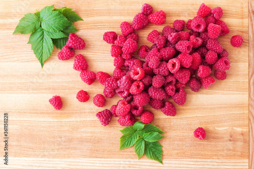 Sweet Raspberries on Wooden Background