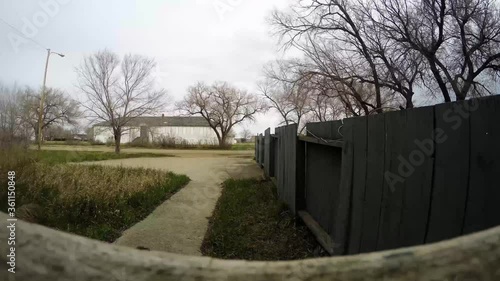 Wallpaper Mural TIME LAPSE - The front of a yard in November as the wind blows around the trees and clouds in a small town. Torontodigital.ca