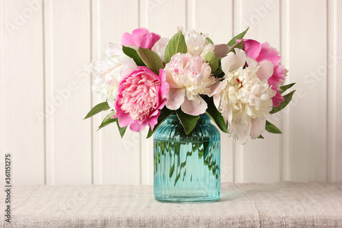 bouquet of peonies on a light background.