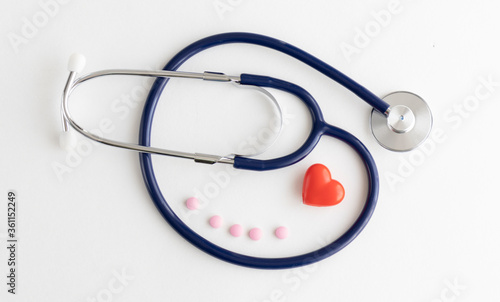 Stethoscope and heart on white background, Close up.
