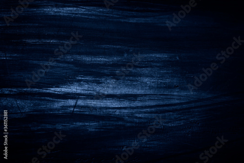 Dark blue abstract background. Blue black grunge background.