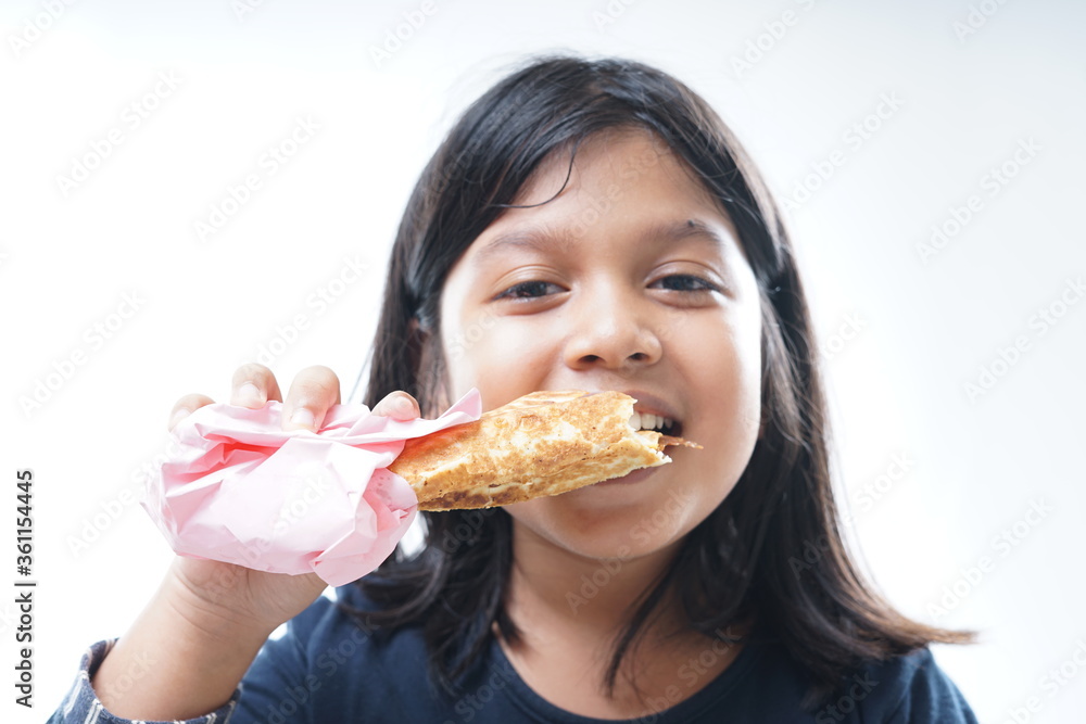 Young Girl eating kebab or shawarma Young Girl eating kebab or shawarma