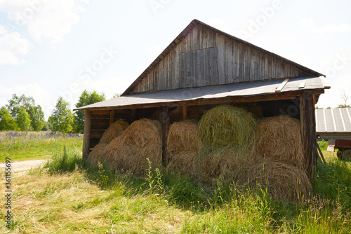 nside Rustic Wooden Old Barn Hay Bales Straw Sunlight Rays Light Beams Farm photo