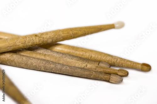 bunch of drum sticks scattered / isolated white background