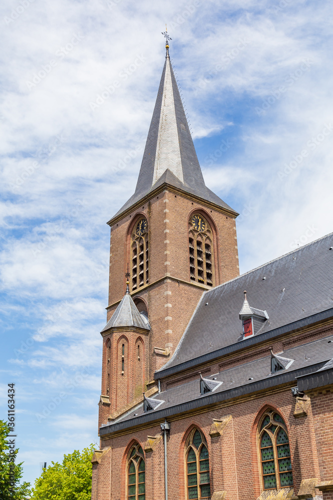 Tower of the protestant gothic church of the little Dutch village Rechteren in Overijssel, Netherlands, Europe