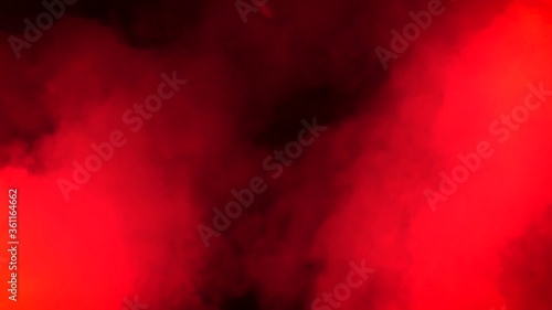 Red smoke and stroboscope lights effects. Footage. Slowmotion of smoke on the black background.