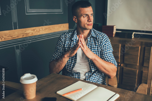 Fotografi Calm pensive adult freelancer with notepad and beverage to go contemplating list