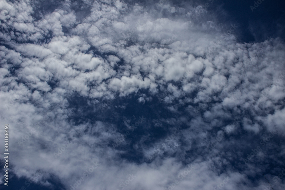 Obraz premium Clouds on the blue sky. Background, texture.