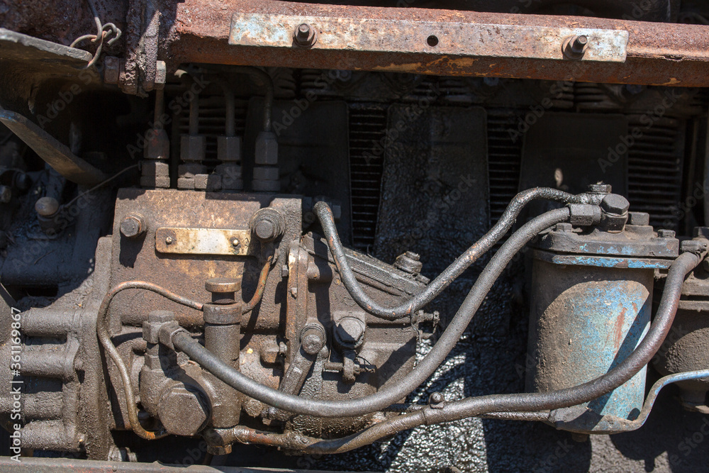 Fototapeta premium rusty old motor engine oil, bolts and nuts close up
