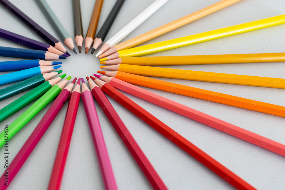 a selection of colourful pencils set in a circle rainbow 