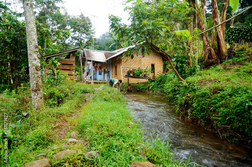 Rural mountain little village with river and typical Indonesian countryside houses on the west Java  Indonesia