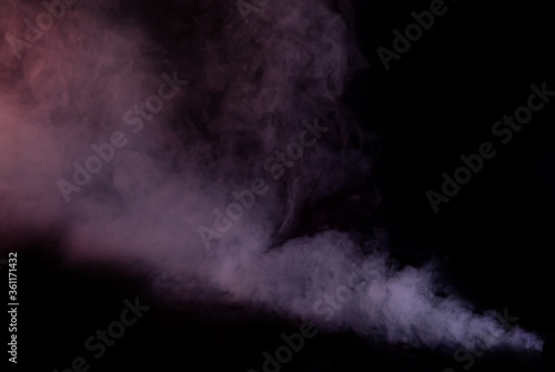 White smoke on a black background. Colored smoke with a blue and red tinge. The texture of scattered smoke. Blank for design. Layout for collages.