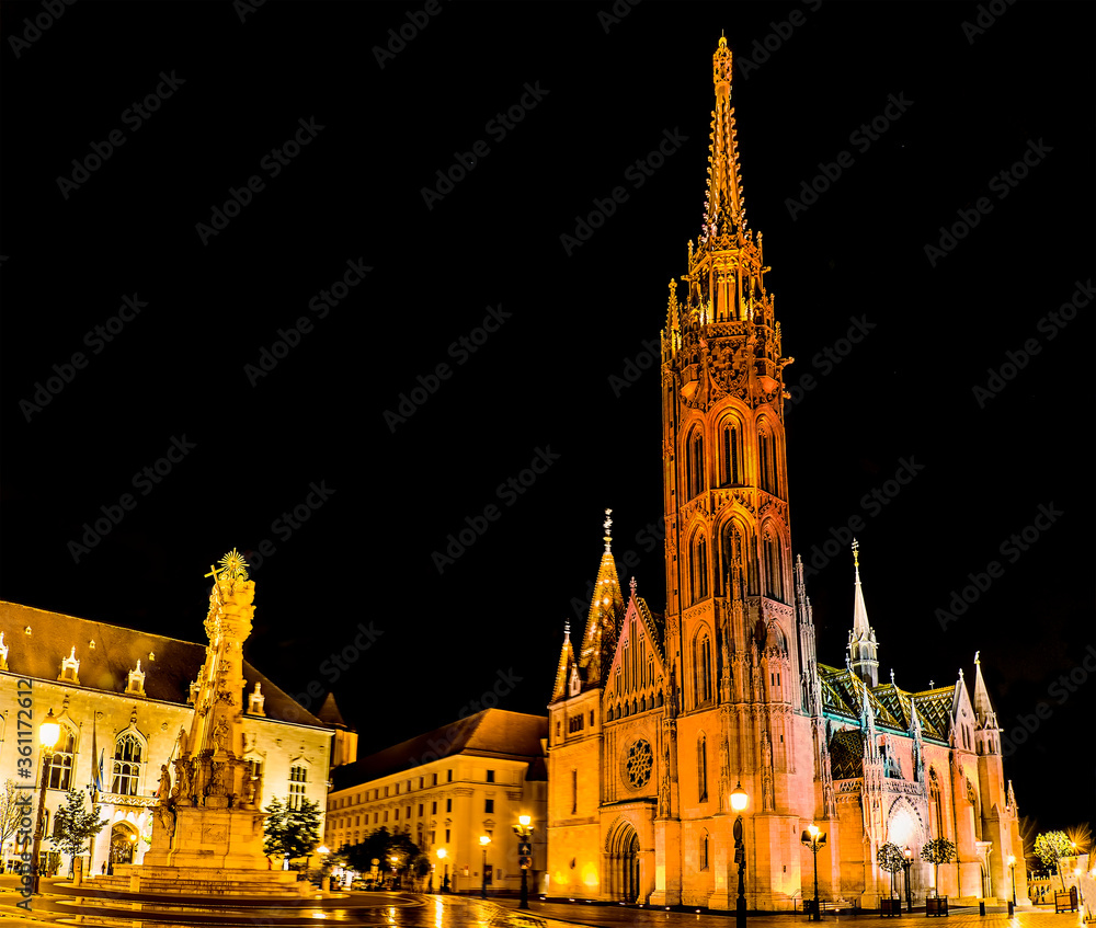 The view of the Matthias Church and the Castle District in Budapest at night in the summertime