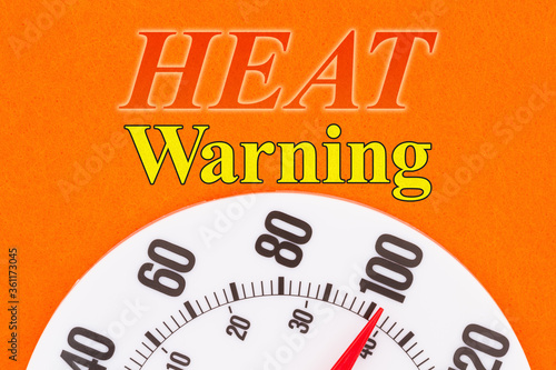 Heat Warning word message with closeup of a thermometer at 100 degrees