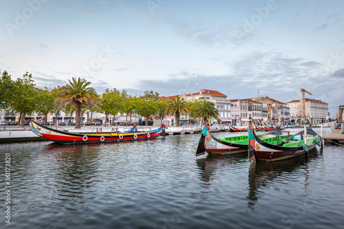 Colorful Moliceiro boat rides in Aveiro are popular with tourists to enjoy views of the charming canals.