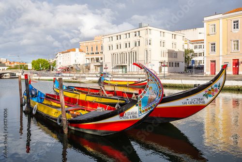 Colorful Moliceiro boat rides in Aveiro are popular with tourists to enjoy views of the charming canals.