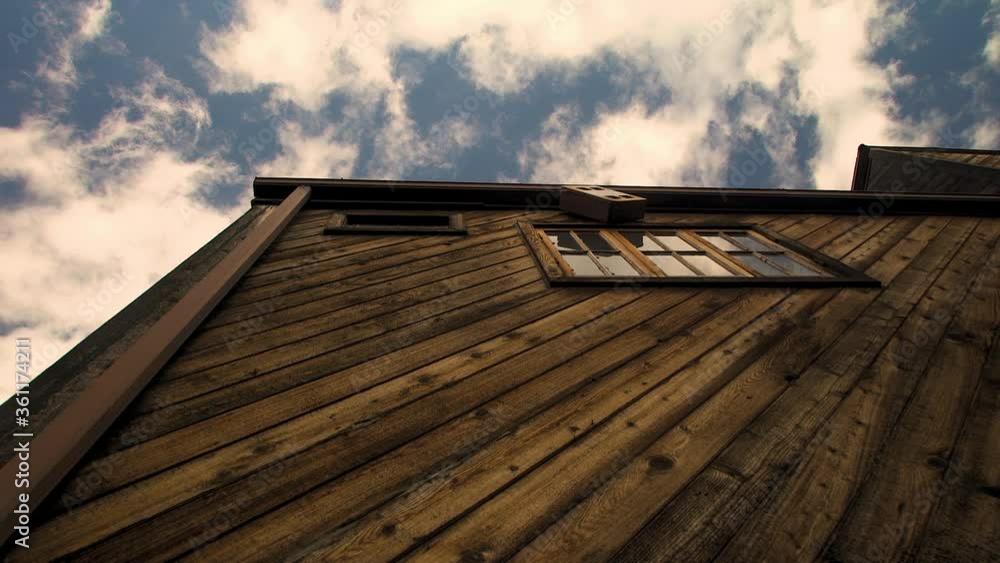 Time-lapse of Clouds behind a Wooden Cabin with Copy-space Time-lapse of Clouds behind a Wooden Cabin with Copy-space