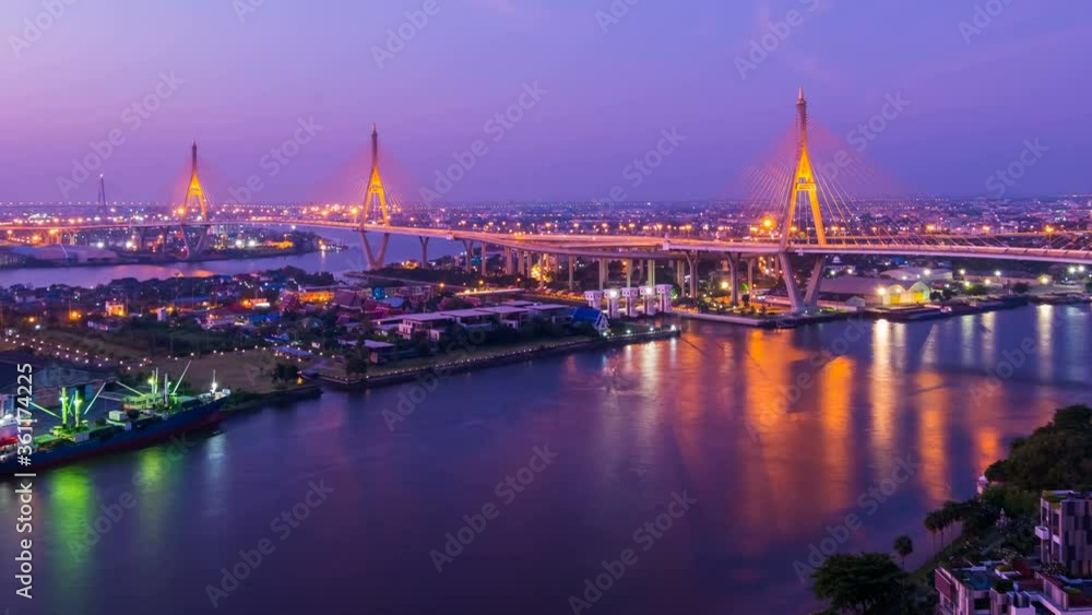 night to day time lapse of Bhumibol suspension bridge cross over Chao Phraya River at sunset in Bangkok city, Thailand night to day time lapse of Bhumibol suspension bridge cross over Chao Phraya River at sunset in Bangkok city, Thailand