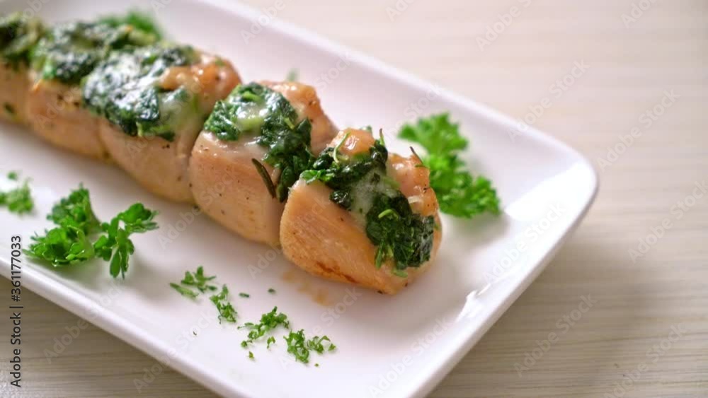 Chicken breasts stuffed with spinach and cheese on plate Chicken breasts stuffed with spinach and cheese on plate