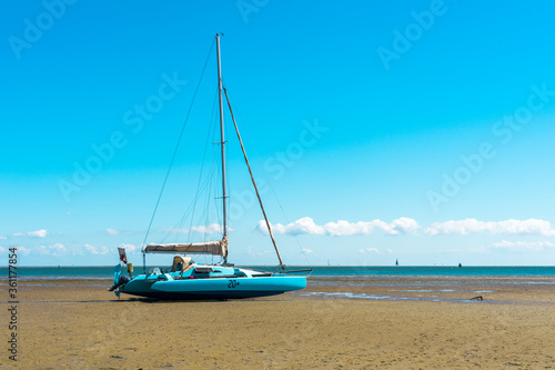 Twin deck catamaran sail vessel run upon the sands on Terschelling island  strike bottom  get aground 