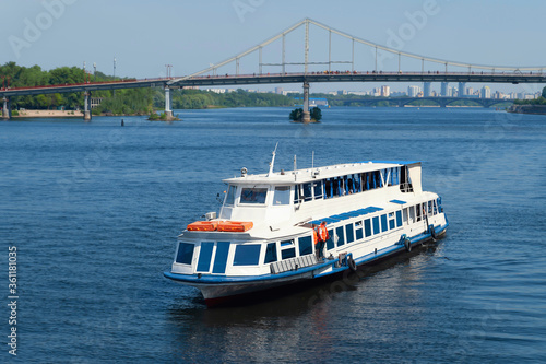 Cruise ship sails along the river. Navigation on the Dnieper.
