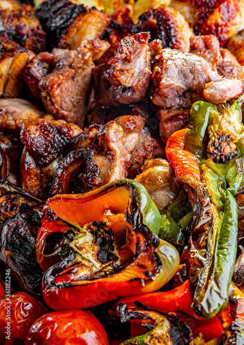 Assorted Mixed different grilled meat with vegetables on table