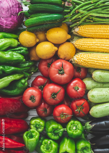 summer vegetables in the refrigerator. Delicious vegetables for summer vegetables corn  tomato  cucumber  eggplant  zucchini  pepper  paprika  green pepper  purple cabbage. organic vegetables. vegetab