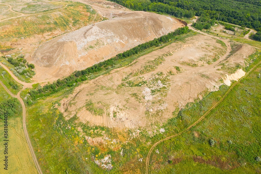 Aerial view of municipal landfill site. Typical waste treatment technology top view. Aerial view of municipal landfill site. Typical waste treatment technology top view.