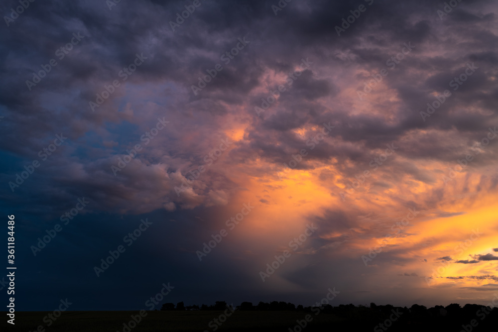 Fototapeta premium Storm clouds at dusk creating layers in the sky
