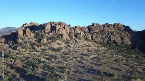 4K aerial drone video of African savanna hills, large red granite boulders range near B1 highway south of Windhoek in central highland Khomas Hochland of Namibia, southern Africa