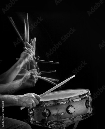 Canvas Print Drummer's hands  and drumsticks in motion  hitting a snare drum