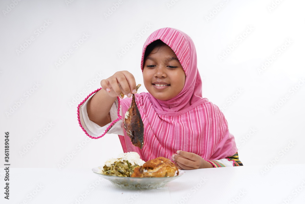 Asian Muslim Schoolgirl having lunch Asian Muslim Schoolgirl having lunch