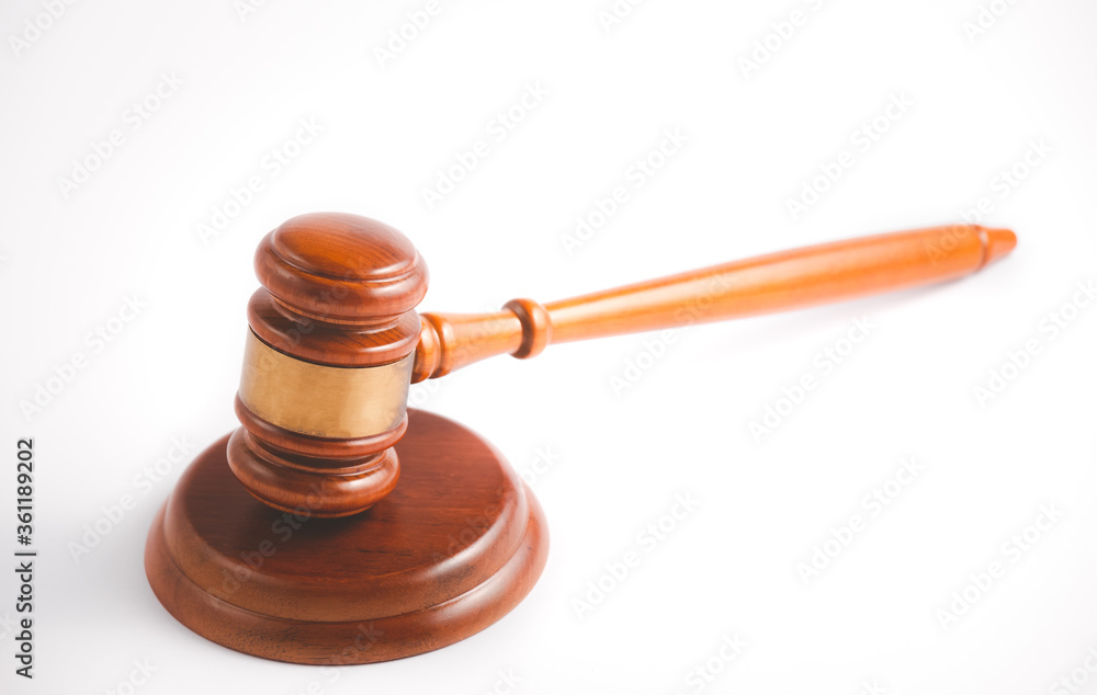 Old wood Judge hammer with law book on the white background, Used for adjudication and Justice. Old wood Judge hammer with law book on the white background, Used for adjudication and Justice.