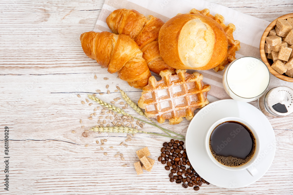 Breakfast in the morning with black coffee cup with bread with Croissant and fruit on the wooden table. Breakfast in the morning with black coffee cup with bread with Croissant and fruit on the wooden table.