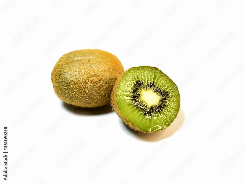 Whole kiwi and half juicy kiwi on a white background. Whole kiwi and half juicy kiwi on a white background.