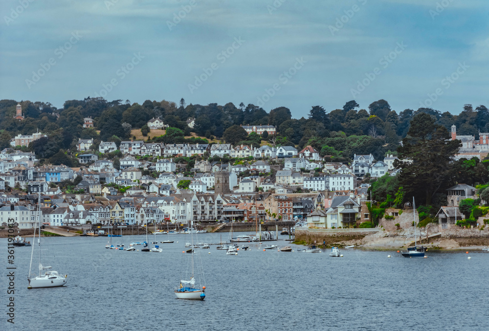 shot of the River Dart with Kingswear in the background. Boats on the river Dart in Dartmouth, South Devon. The town of Kingswear can be seen in the background.