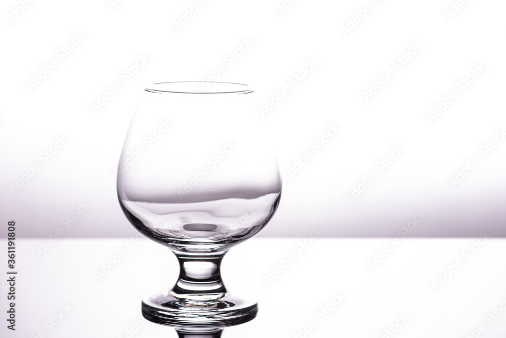 one transparent glass cognac glass isolated on a white background one transparent glass cognac glass isolated on a white background