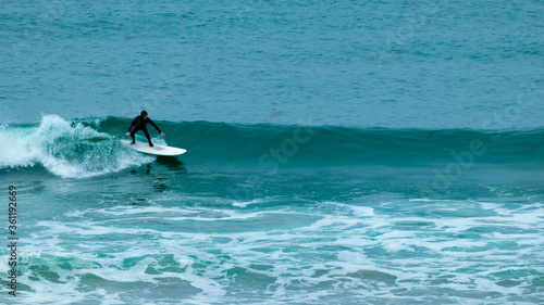 Photography Man surfing in the pacific ocean