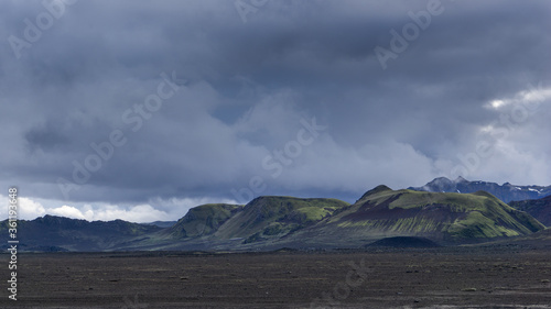 Mountainous landscape in the Landmannalaugar area, deep within the incredible central highlands of Iceland. The mountains are extremely colorful due to volcanic activity of the Torfajökull volcano.