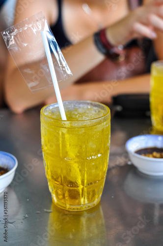 Cold fresh green iced tea in a bar in Saigon / Ho Chi Minh City. The weather is muggy warm, high humidity, the iced tea is refreshing at any time of the day.