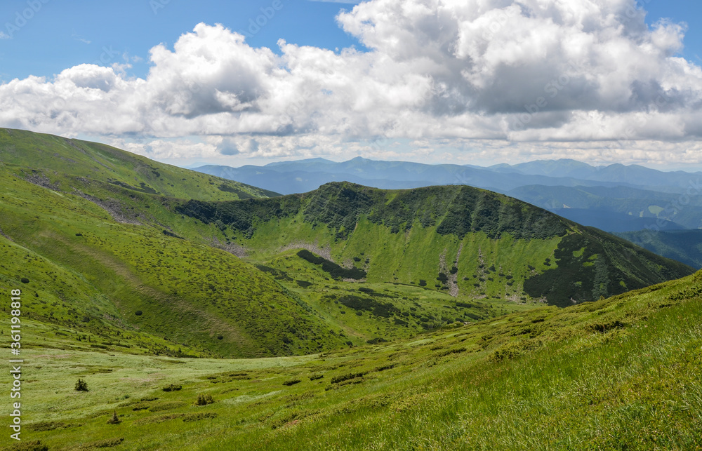 Scenic landscape of Mountain range Chornohora with green slopes in summer day. Carpathian Mountains.