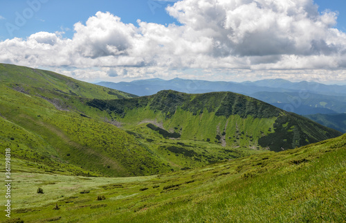Scenic landscape of Mountain range Chornohora with green slopes in summer day. Carpathian Mountains.