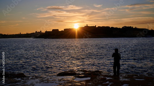 Angler beim Sonnenuntergang © campixx