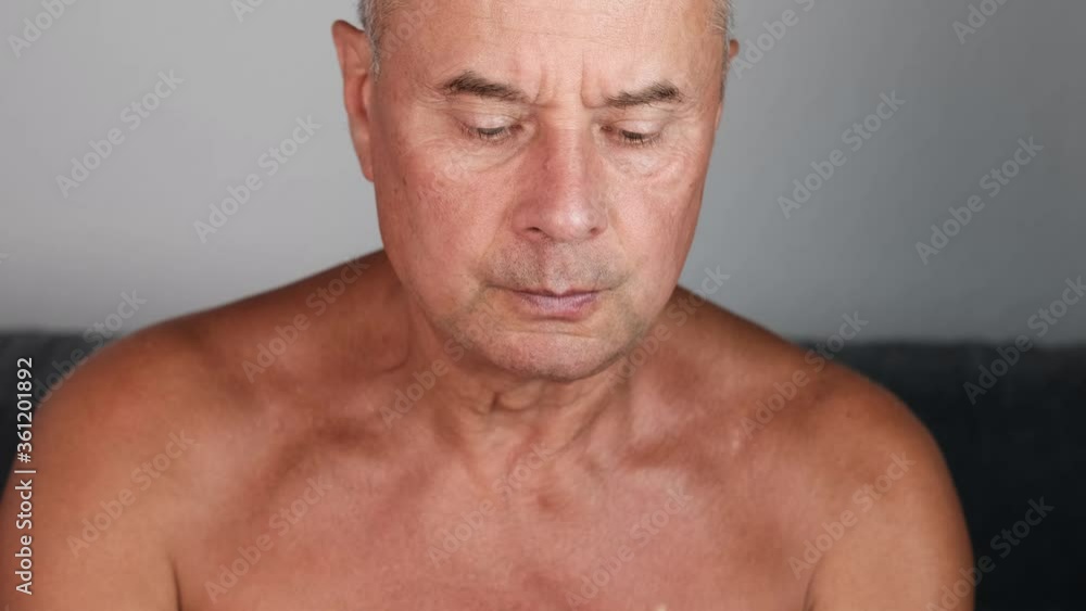 tanned old man appetizingly eats a slice of ripe yellow pineapple, the concept of vegetarian food, relaxation in exotic countries tanned old man appetizingly eats a slice of ripe yellow pineapple, the concept of vegetarian food, relaxation in exotic countries